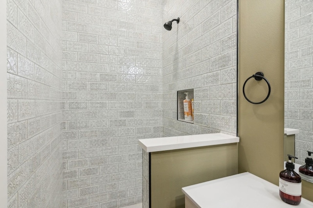 bathroom with tiled shower