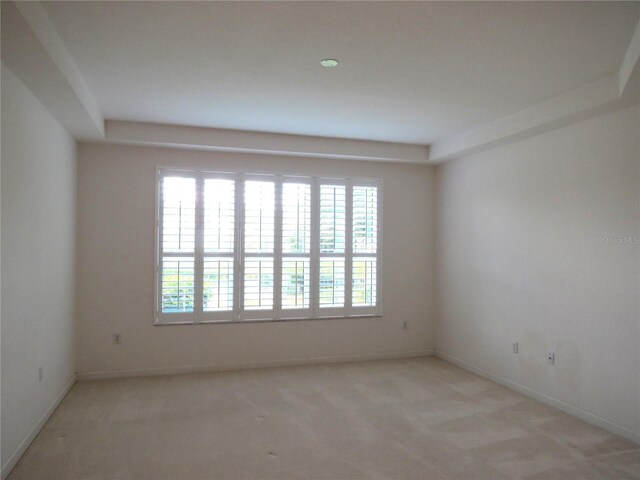 empty room with light colored carpet