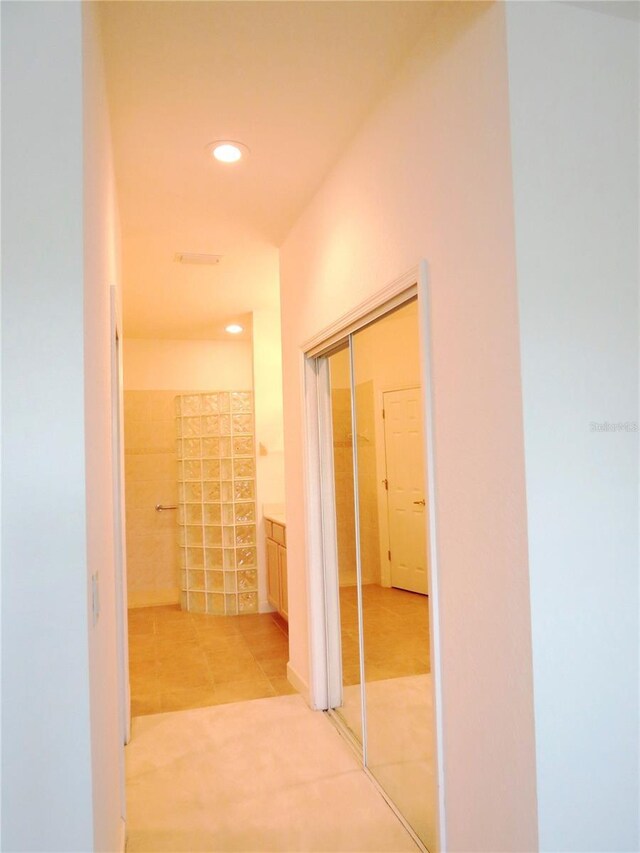 hallway with light tile patterned floors