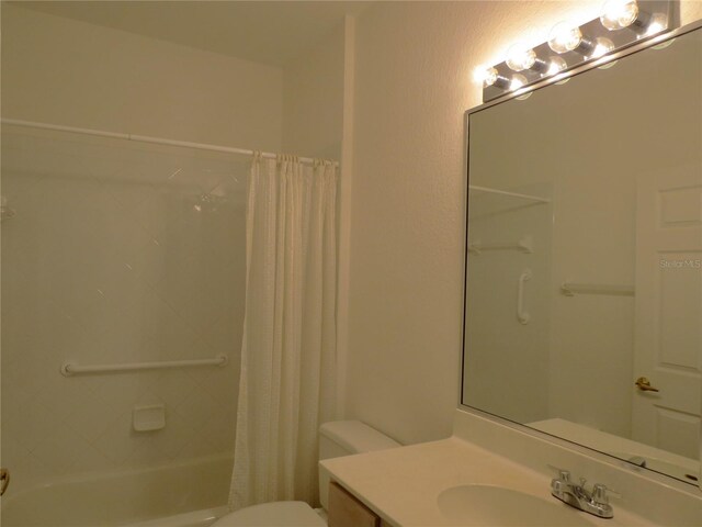 full bathroom with vanity, toilet, and shower / bath combination with curtain