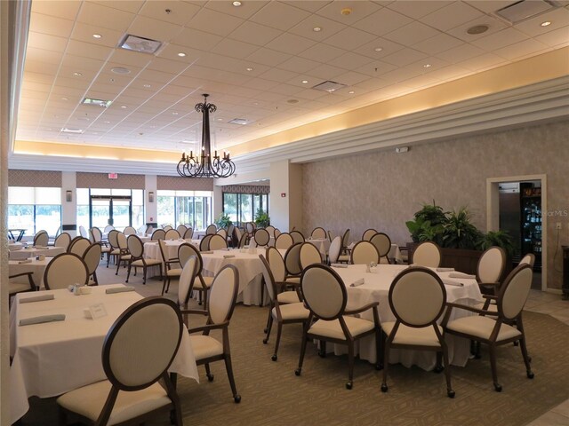 dining space featuring a notable chandelier