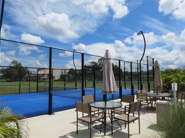 exterior space with tennis court