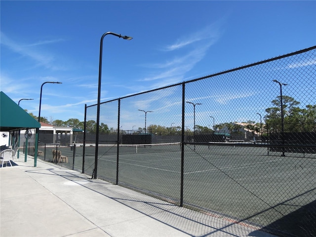 view of sport court with fence