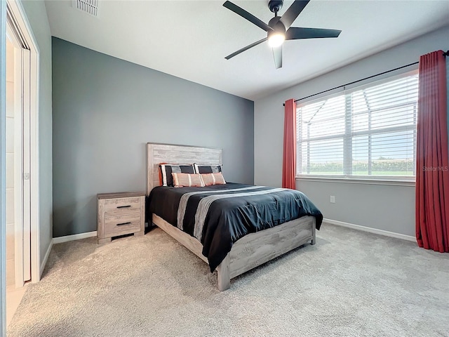 bedroom featuring ceiling fan and light colored carpet