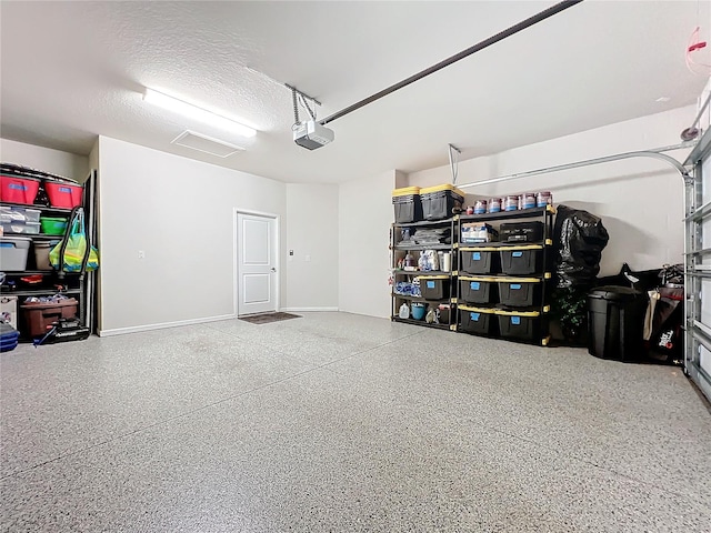 garage featuring a garage door opener