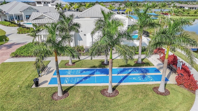 view of pool with a yard