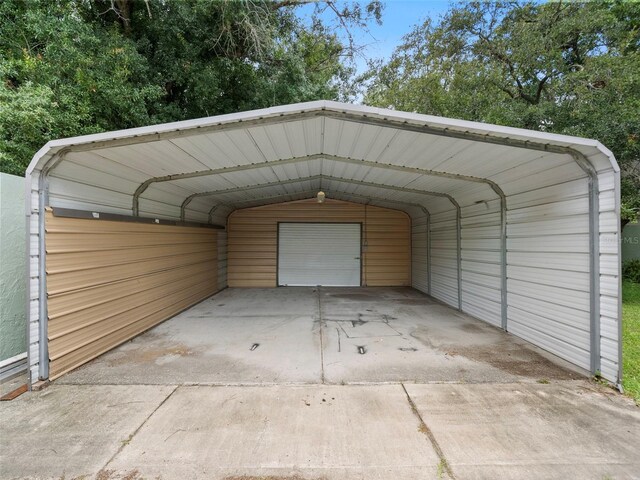 garage featuring a carport