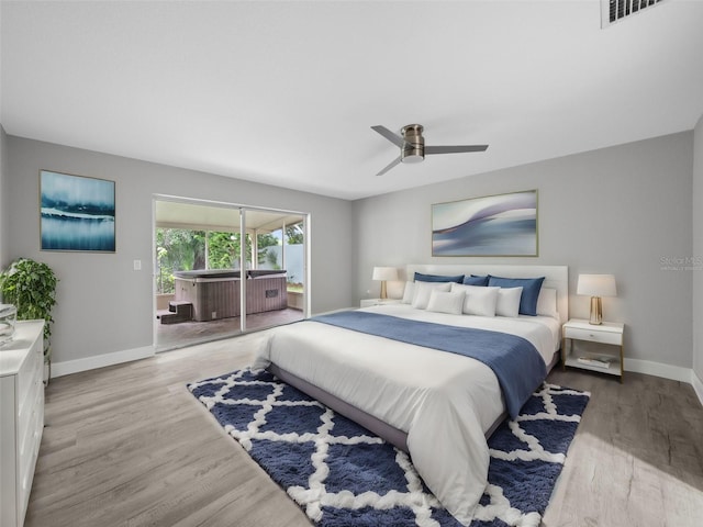 bedroom with ceiling fan and light hardwood / wood-style flooring