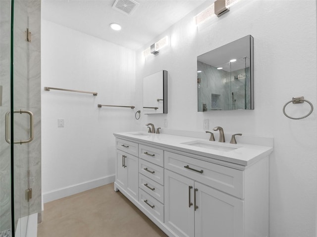 bathroom featuring vanity, tile patterned flooring, and a shower with door