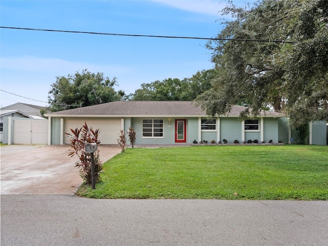 single story home featuring a front yard and a garage