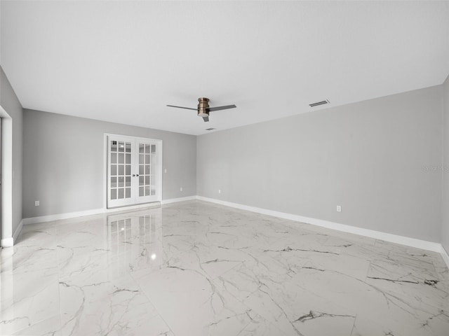 unfurnished room featuring ceiling fan and french doors