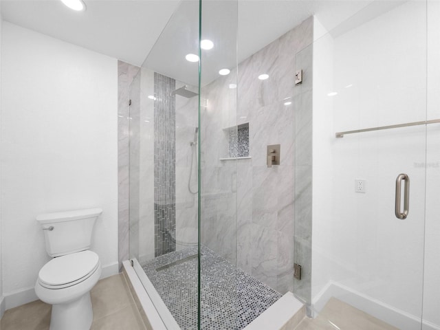 bathroom with toilet, tile patterned floors, and an enclosed shower