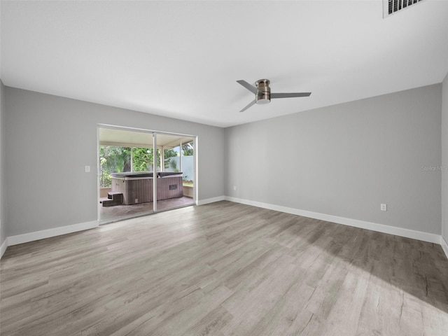 unfurnished room featuring ceiling fan and light hardwood / wood-style floors