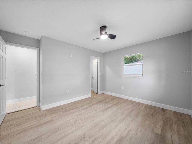 empty room featuring ceiling fan and light hardwood / wood-style floors