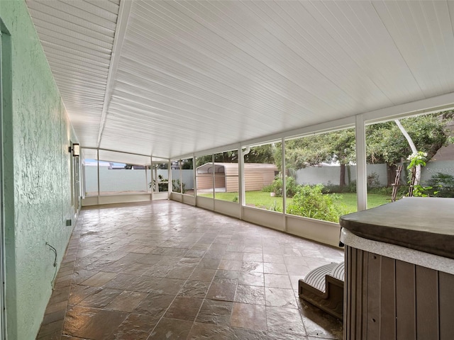 unfurnished sunroom with plenty of natural light