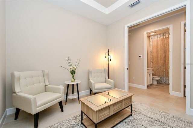 living area featuring light tile patterned floors