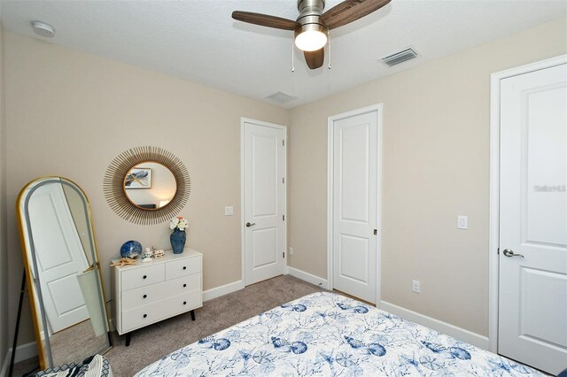 carpeted bedroom featuring ceiling fan