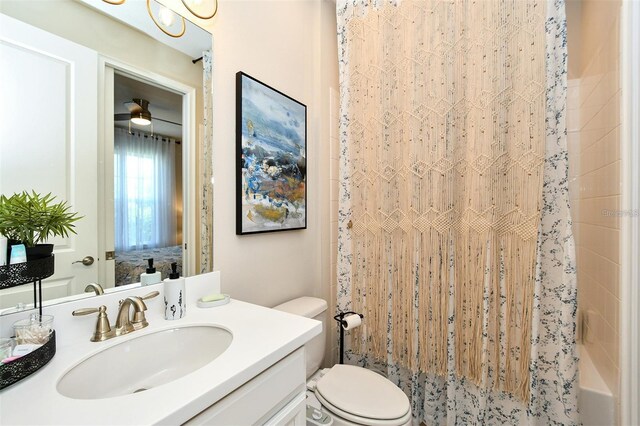 full bathroom featuring vanity, toilet, and shower / bathtub combination with curtain