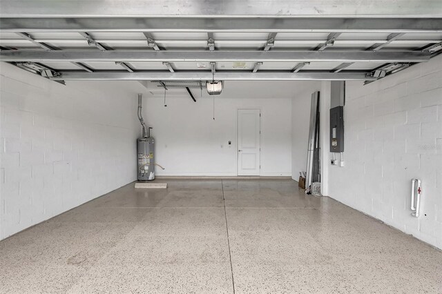 garage featuring gas water heater, a garage door opener, and electric panel