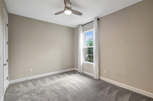 unfurnished room featuring carpet flooring and ceiling fan