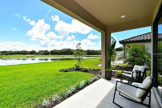 view of patio / terrace featuring a water view