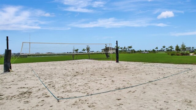 view of community featuring a yard and volleyball court