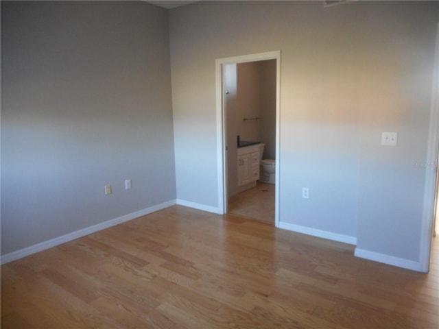 empty room with light wood-type flooring