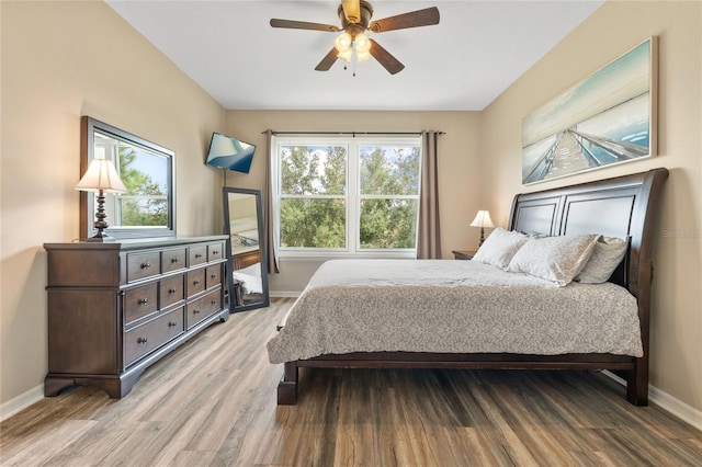 bedroom with light wood-type flooring and ceiling fan