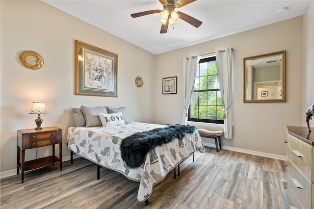 bedroom featuring ceiling fan and hardwood / wood-style flooring