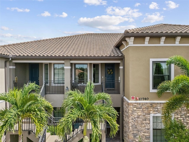 view of front of property with a balcony