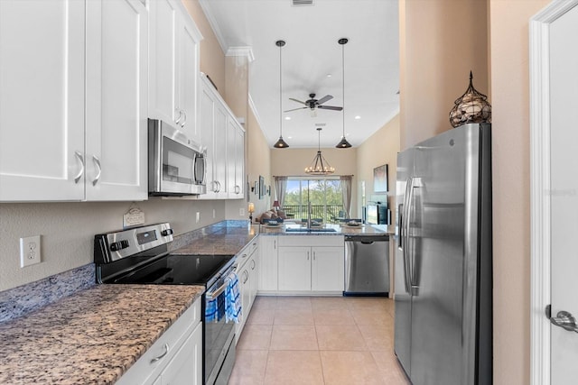 kitchen featuring light tile patterned floors, light stone counters, ceiling fan with notable chandelier, white cabinets, and appliances with stainless steel finishes