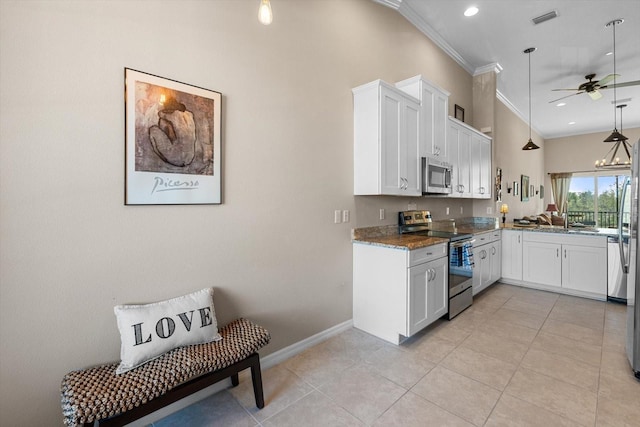 kitchen with visible vents, white cabinets, ornamental molding, stainless steel appliances, and a sink