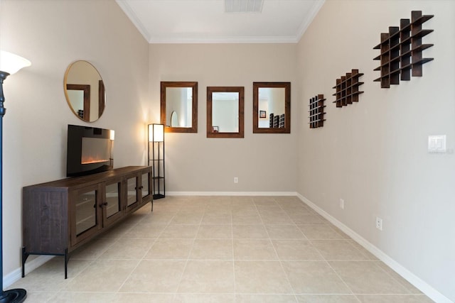 living area featuring light tile patterned floors, ornamental molding, visible vents, and baseboards