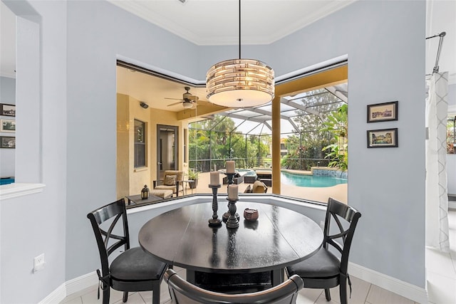 tiled dining room featuring ceiling fan and ornamental molding