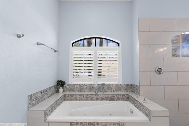 bathroom with tiled bath