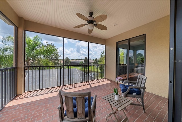 sunroom with ceiling fan and a healthy amount of sunlight