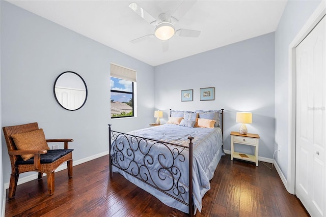 bedroom featuring a closet, dark wood-type flooring, and ceiling fan