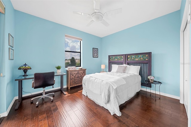 bedroom with ceiling fan and dark hardwood / wood-style flooring