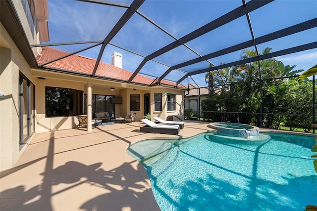 view of pool featuring an in ground hot tub, a lanai, ceiling fan, and a patio area