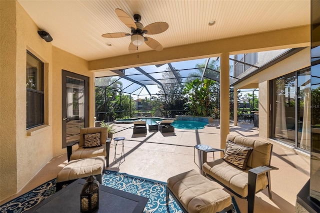 view of patio with ceiling fan, a lanai, and an outdoor hangout area