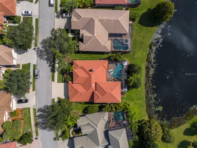 birds eye view of property featuring a water view