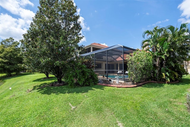 view of yard featuring glass enclosure