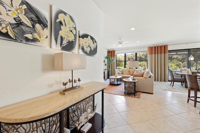 living room featuring ceiling fan and light tile patterned floors