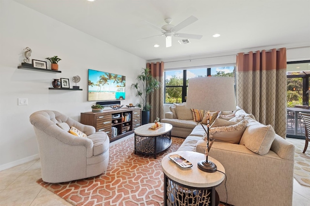 living room with ceiling fan and light tile patterned floors