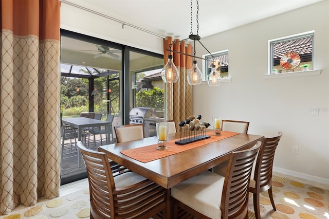 tiled dining room with ceiling fan