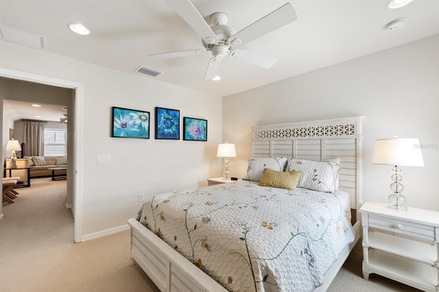 bedroom featuring light carpet and ceiling fan