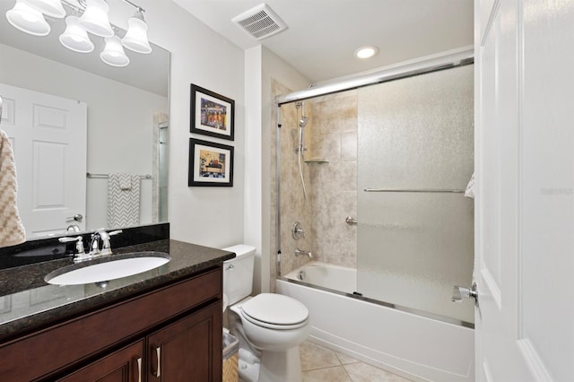 full bathroom featuring vanity, toilet, bath / shower combo with glass door, and tile patterned floors