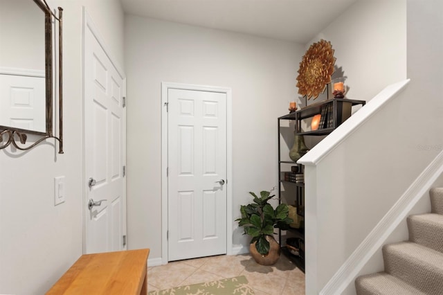 entrance foyer featuring light tile patterned floors