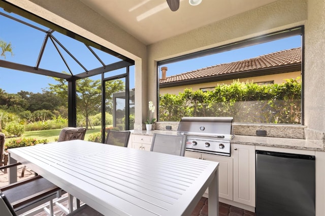 view of patio with ceiling fan, grilling area, and area for grilling