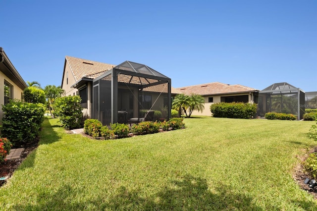 view of yard with a lanai